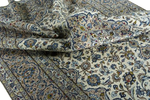 Surface texture of 2000s Kashan rug with natural Wool and intricate pattern