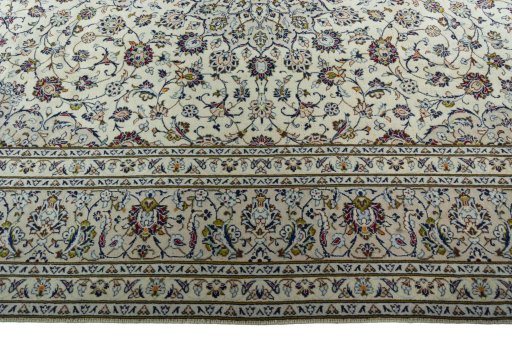 Corner detail of 2000s Kashan rug showing border pattern and Wool pile