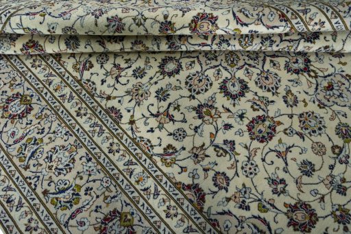 Close-up detail of 2000s Kashan rug from Iran / Persia showing Wool weave