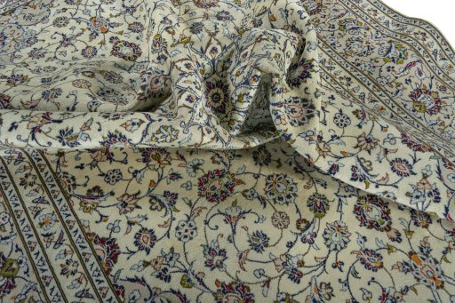Surface texture of 2000s Kashan rug with natural Wool and intricate pattern