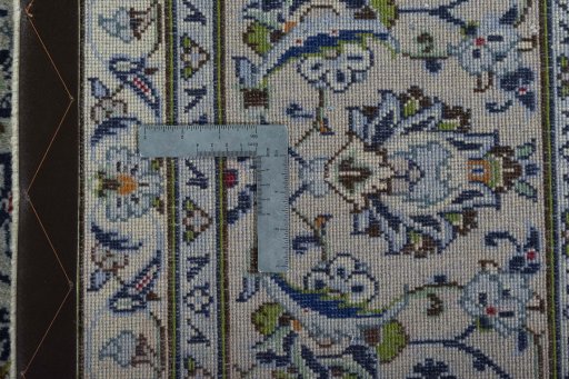 Backside of handmade 2000s Kashan rug showing knot structure and weave density