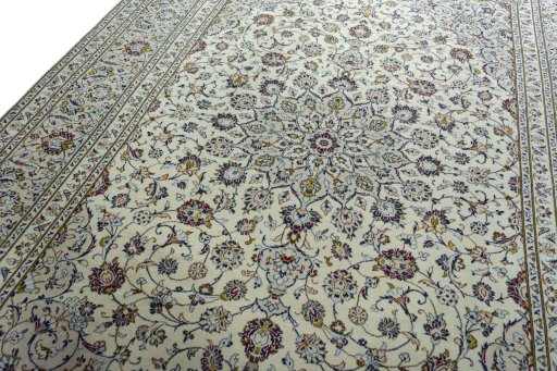 Backside of handmade 2000s Kashan rug showing knot structure and weave density