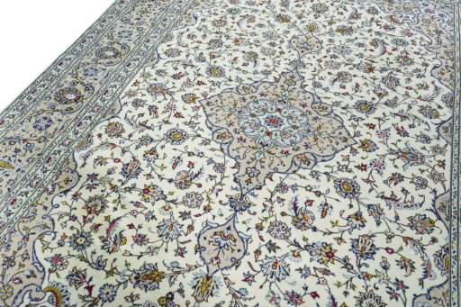 Backside of handmade 2000s Kashan rug showing knot structure and weave density