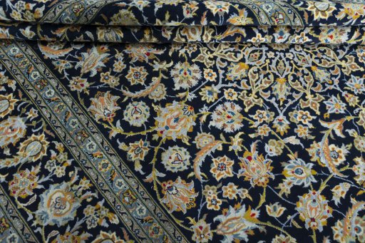 Close-up detail of 2000s Kashan rug from Iran / Persia showing Wool weave