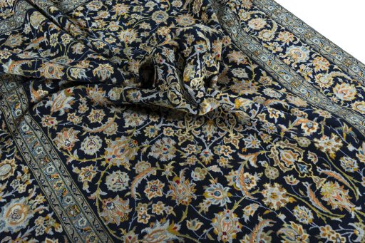 Surface texture of 2000s Kashan rug with natural Wool and intricate pattern