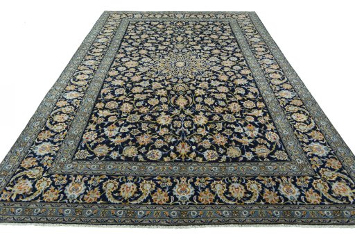 Surface texture of 2000s Kashan rug with natural Wool and intricate pattern