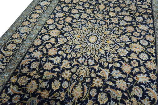 Backside of handmade 2000s Kashan rug showing knot structure and weave density