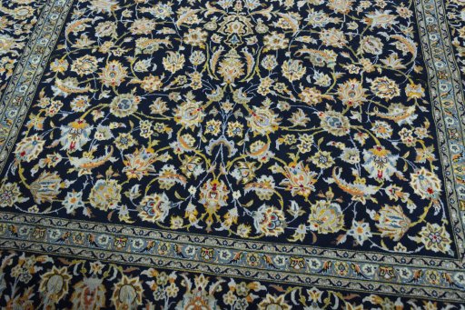 Close-up detail of 2000s Kashan rug from Iran / Persia showing Wool weave