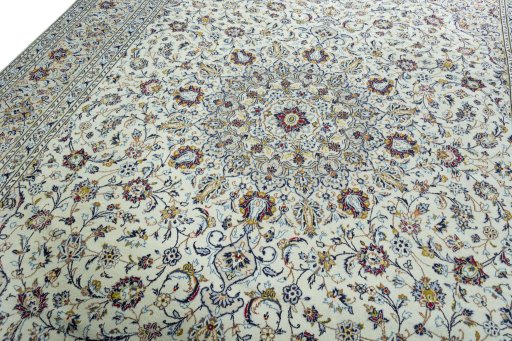 Backside of handmade 2000s Kashan rug showing knot structure and weave density
