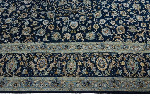 Corner detail of 2000s Kashan rug showing border pattern and Wool pile