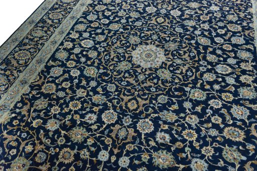 Backside of handmade 2000s Kashan rug showing knot structure and weave density