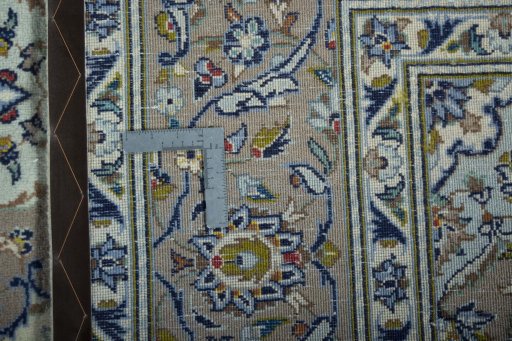 Backside of handmade 2000s Kashan rug showing knot structure and weave density