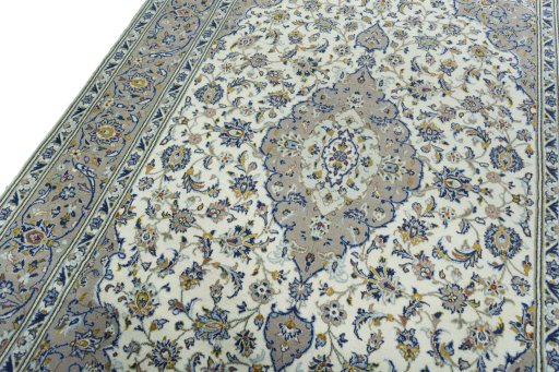 Backside of handmade 2000s Kashan rug showing knot structure and weave density