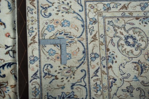 Backside of handmade 2000s Kashan rug showing knot structure and weave density