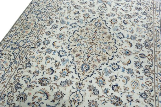 Backside of handmade 2000s Kashan rug showing knot structure and weave density