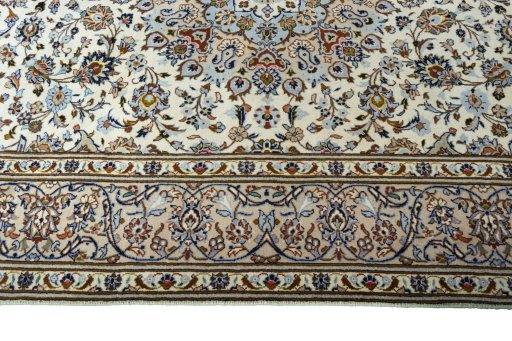 Corner detail of 2000s Kashan rug showing border pattern and Wool pile