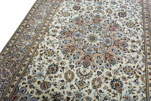 Backside of handmade 2000s Kashan rug showing knot structure and weave density