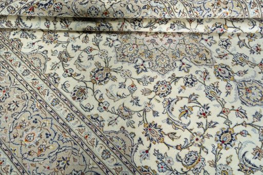 Close-up detail of 2000s Kashan rug from Iran / Persia showing Wool weave