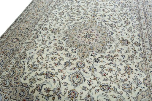 Backside of handmade 2000s Kashan rug showing knot structure and weave density