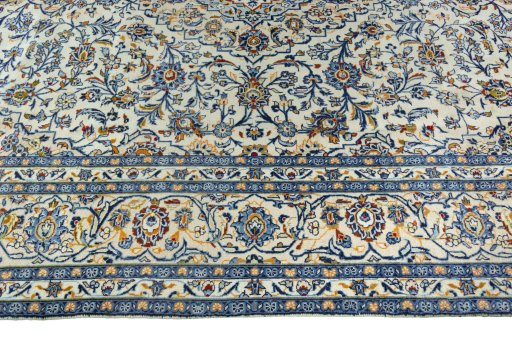 Corner detail of 2000s Kashan rug showing border pattern and Wool pile
