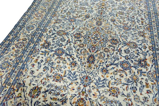 Backside of handmade 2000s Kashan rug showing knot structure and weave density