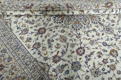 Close-up detail of 2000s Kashan rug from Iran / Persia showing Wool weave