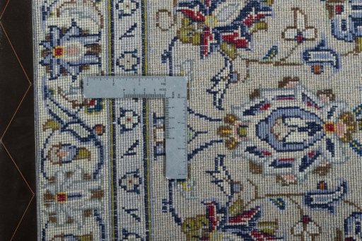 Backside of handmade 2000s Kashan rug showing knot structure and weave density