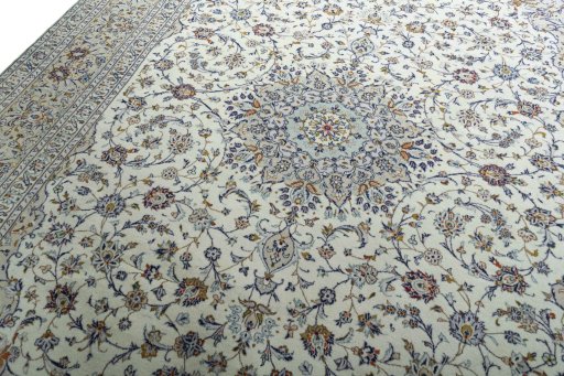 Backside of handmade 2000s Kashan rug showing knot structure and weave density