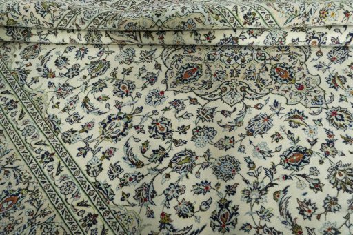 Close-up detail of 2000s Kashan rug from Iran / Persia showing Wool weave