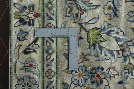 Backside of handmade 2000s Kashan rug showing knot structure and weave density