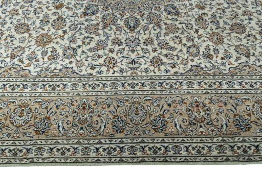 Corner detail of 2000s Kashan rug showing border pattern and Wool pile