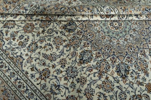 Close-up detail of 2000s Kashan rug from Iran / Persia showing Wool weave
