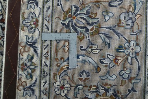 Backside of handmade 2000s Kashan rug showing knot structure and weave density