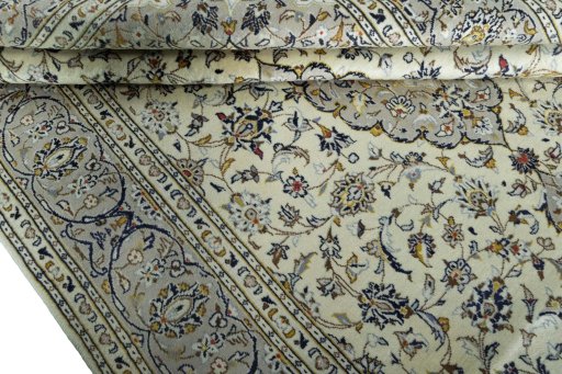 Close-up detail of 2000s Kashan rug from Iran / Persia showing Wool weave