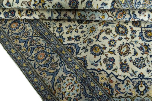 Close-up detail of 2000s Kashan rug from Iran / Persia showing Wool weave