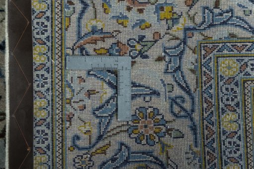 Backside of handmade 2000s Kashan rug showing knot structure and weave density