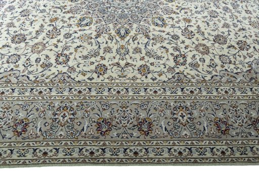 Corner detail of 2000s Kashan rug showing border pattern and Wool pile
