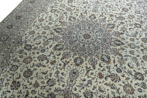 Backside of handmade 2000s Kashan rug showing knot structure and weave density