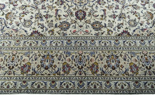 Corner detail of 2000s Kashan rug showing border pattern and Wool pile