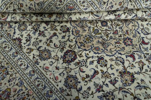 Close-up detail of 2000s Kashan rug from Iran / Persia showing Wool weave