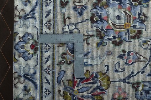 Backside of handmade 2000s Kashan rug showing knot structure and weave density