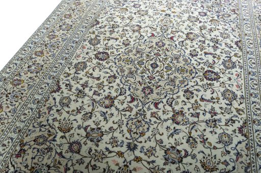 Backside of handmade 2000s Kashan rug showing knot structure and weave density