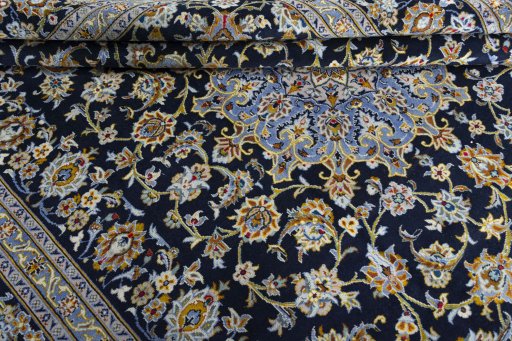 Close-up detail of 2000s Kashan rug from Iran / Persia showing Wool weave