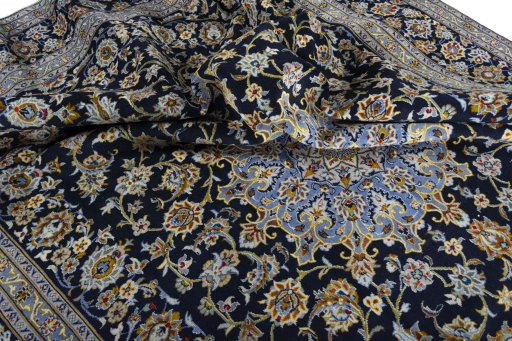 Surface texture of 2000s Kashan rug with natural Wool and intricate pattern