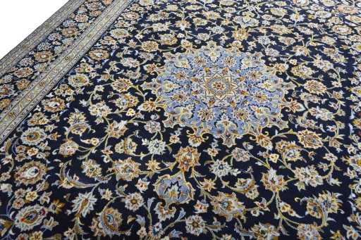 Backside of handmade 2000s Kashan rug showing knot structure and weave density
