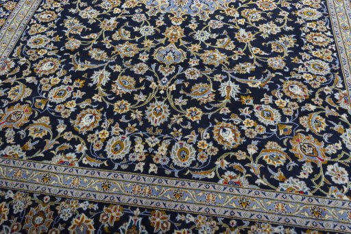 Close-up detail of 2000s Kashan rug from Iran / Persia showing Wool weave