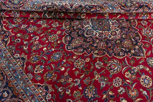 Close-up detail of 2000s Kashan rug from Iran / Persia showing Wool weave