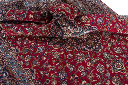 Surface texture of 2000s Kashan rug with natural Wool and intricate pattern