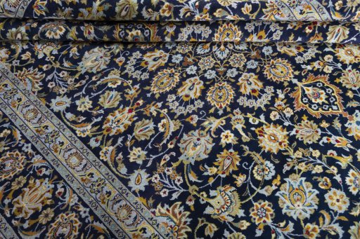 Close-up detail of 2000s Kashan rug from Iran / Persia showing Wool weave