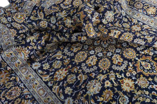 Surface texture of 2000s Kashan rug with natural Wool and intricate pattern